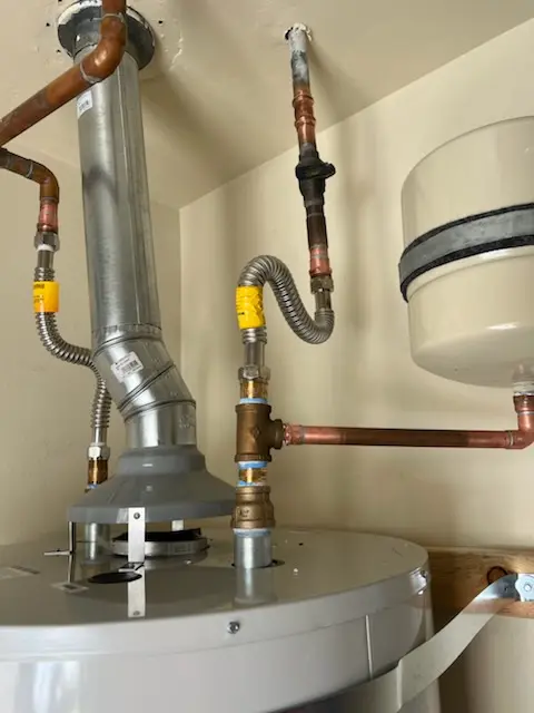 Water heater installation and plumbing repair in Woods Corner